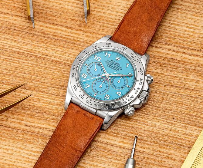 The blue dial fake watch has a brown strap.