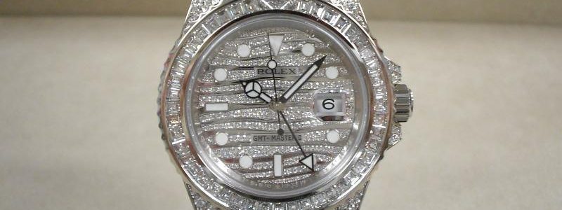 The diamond-paved dial fake watch has a date window.